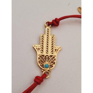 Jewelry red cord with a gold plated charm, cord bracelet with hamsa hand pendant